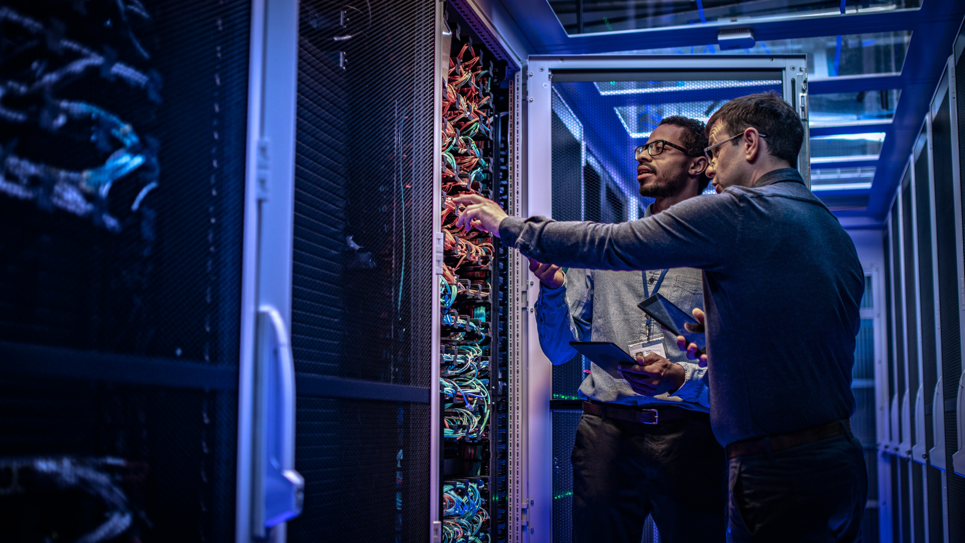 two men working with a server