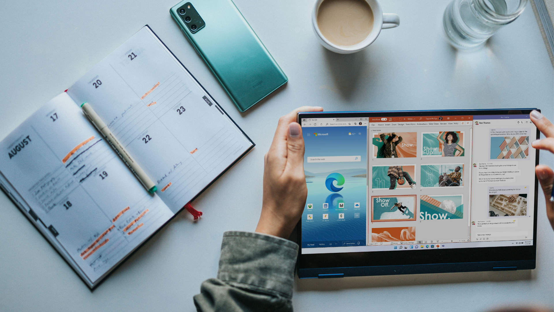 person on tablet with calendar and phone in background