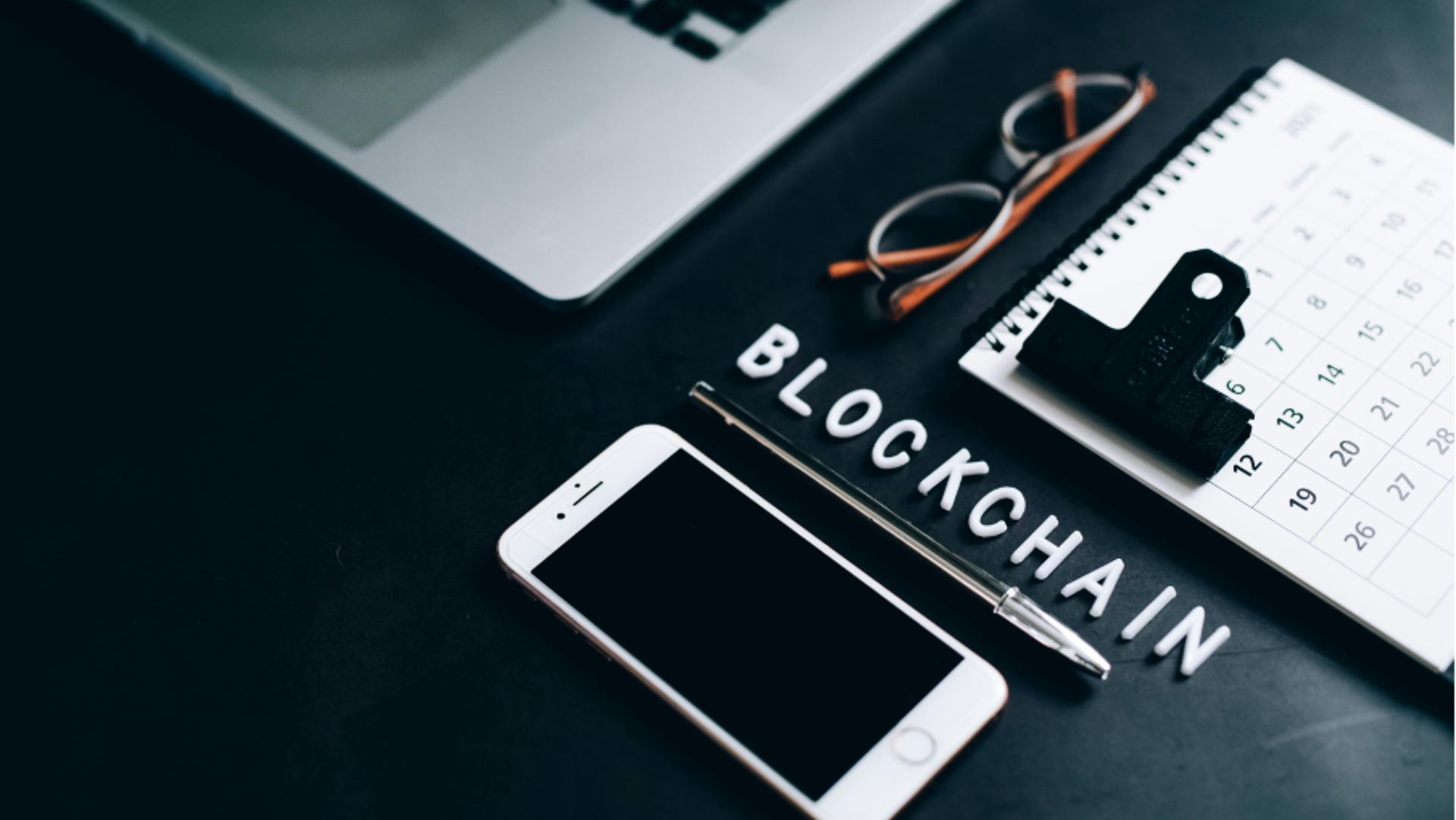 phone next to words saying blockchain